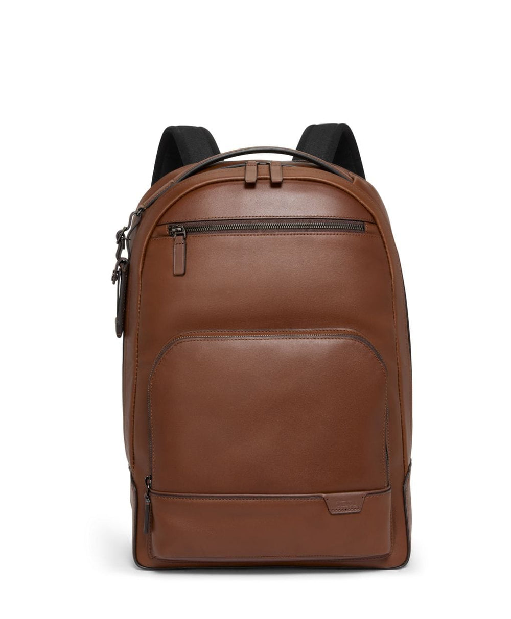 Brown leather backpack with black straps on a white background